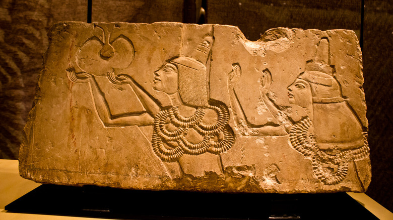Carving of pharaoh Ay praising object