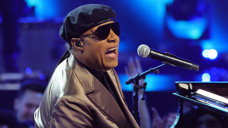 Stevie Wonder singing and playing piano onstage