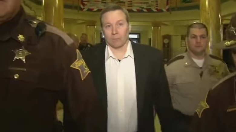 David Camm being led into court by officers