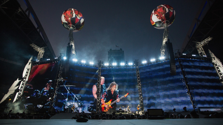 Metallica playing a concert outdoors