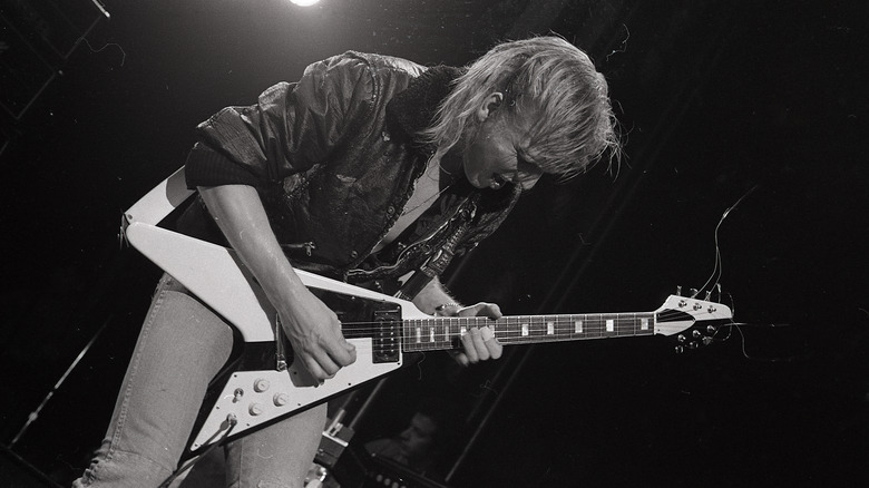 Michael Schenker plays guitar onstage