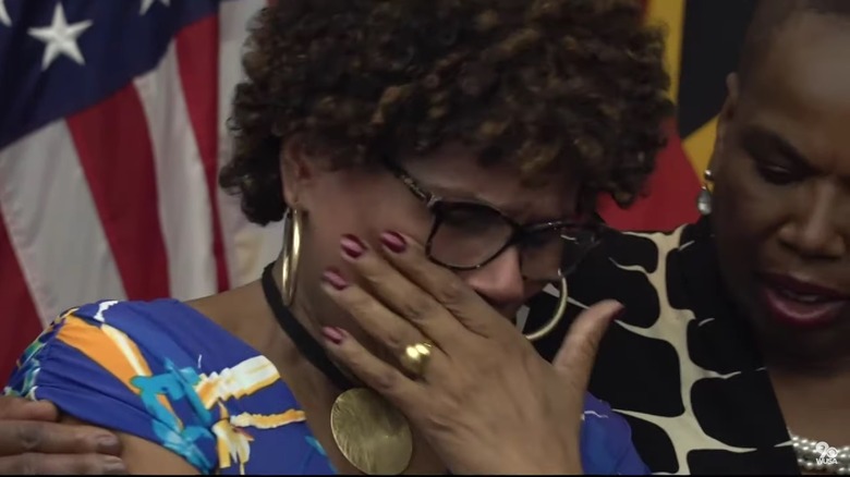 Victim's mother crying at a press conference