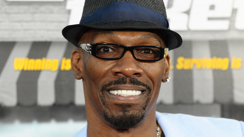 charlie murphy smiling hat and glasses