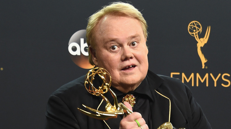 louie anderson black shirt holding emmy