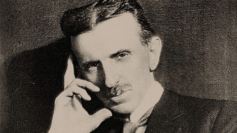 Nikola Tesla hand on face