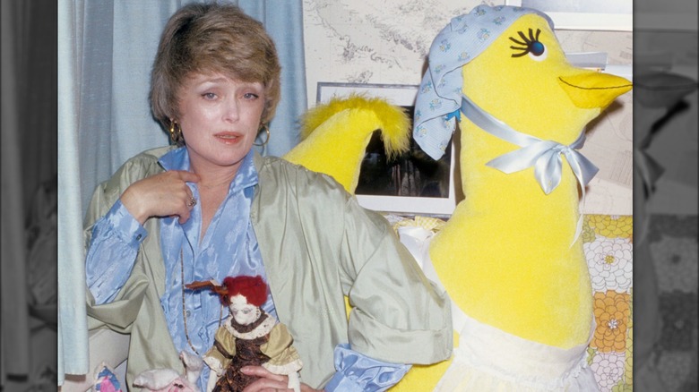 Rue McClanahan holding doll