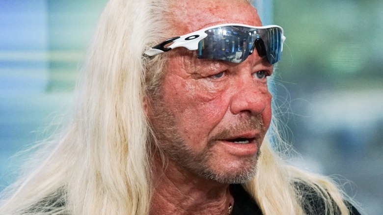 Close-up of Duane "Dog the Bounty Hunter" Chapman wearing sunglasses on his forehead