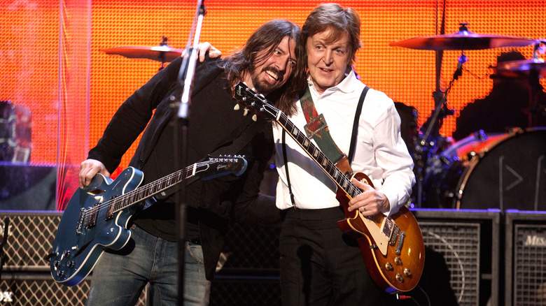 Dave Gorhl hugging Paul McCartney on stage
