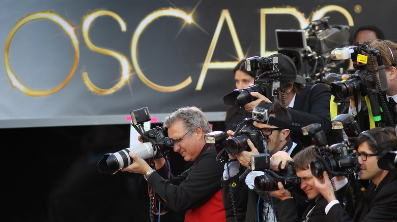 Photographers snapping red carpet shots