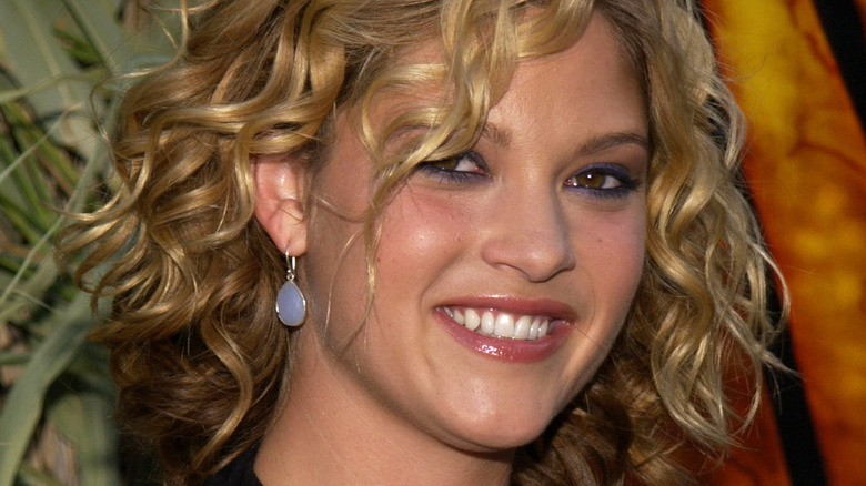 Nicki Aycox smiling curly hair at movie premiere