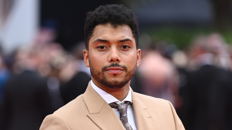 Chance Perdomo tan suit goatee at event