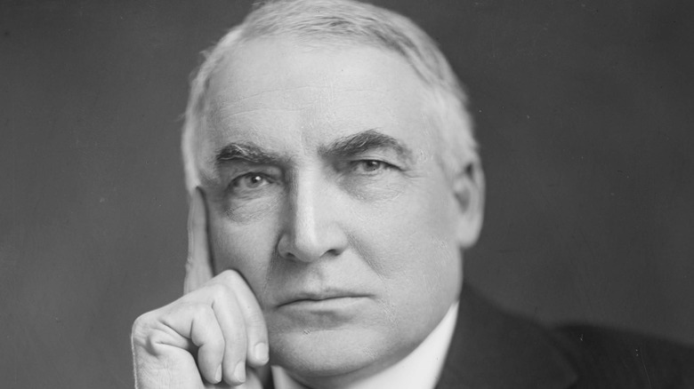 warren g harding with hand on face