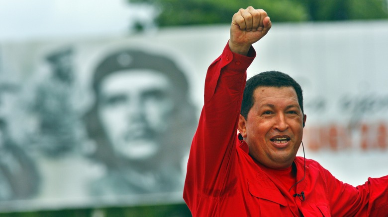 Hugo Chavez hand raised