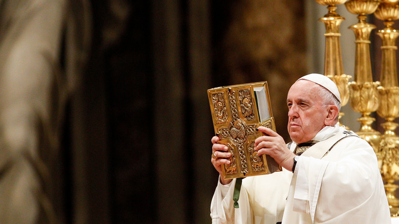 the pope holding book