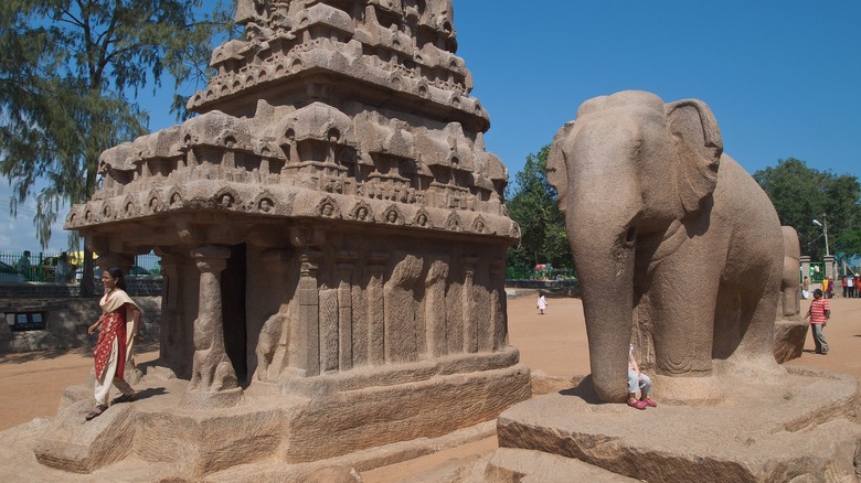 Ornately carved building and elephant statue.