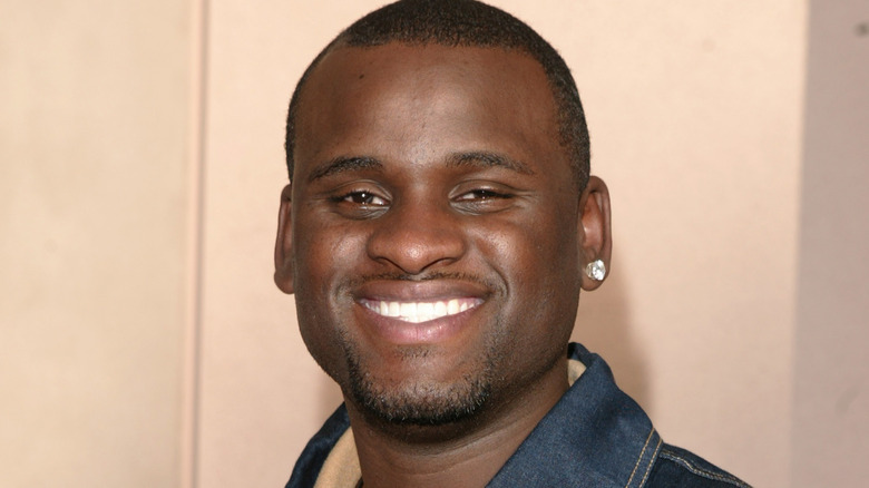 rickey smith squinting smiling earring