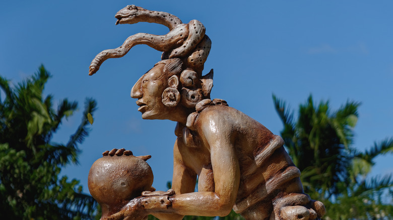 statue of Ix Chel snakes hair