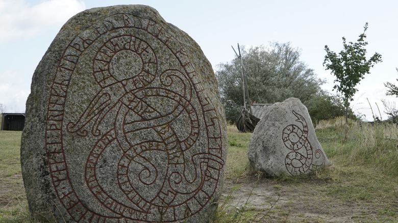 rune stone in field red letters 
