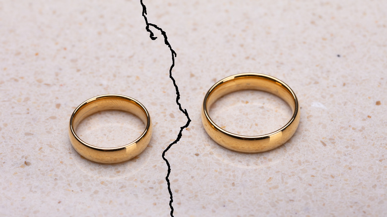 Wedding rings on cracked surface