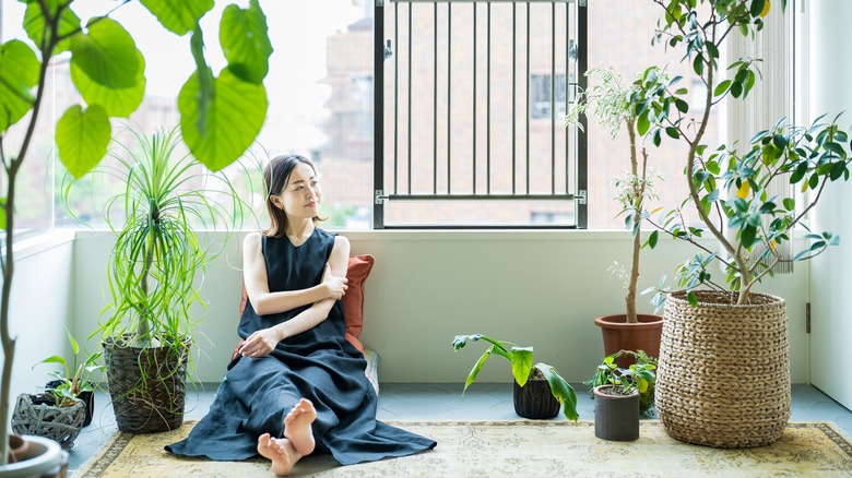 A woman enjoying the company of plants