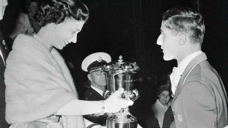 George H. Morris receiving a trophy from Queen Elizabeth II