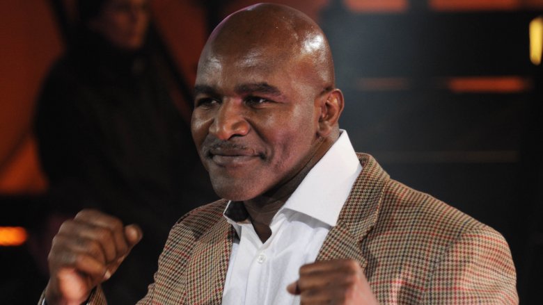 Evander Holyfield smiling fists up