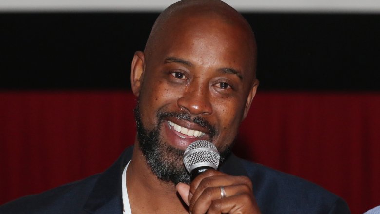 Kenny Anderson smiling at mic
