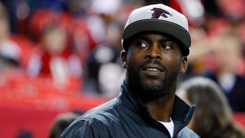 Michael Vick looking up white cap