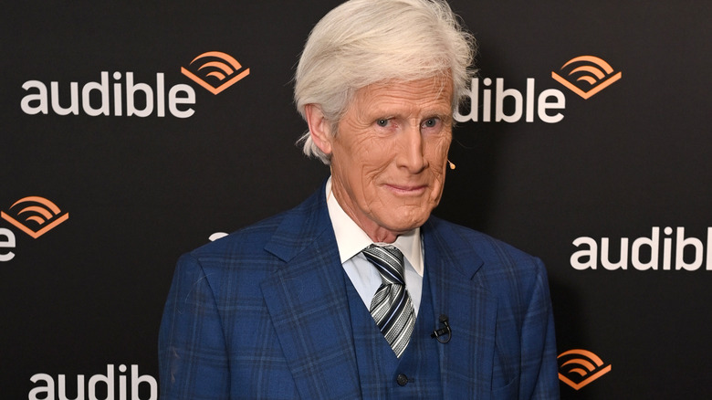 Keith Morrison in blue suit smiling audible poster background