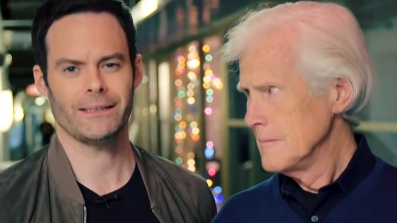 Bill Hader grinning with stern Keith Morrison in hallway