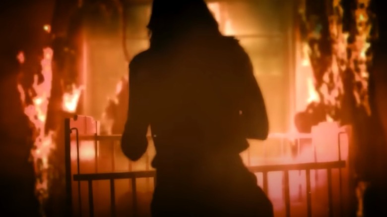 woman in a nursery on fire