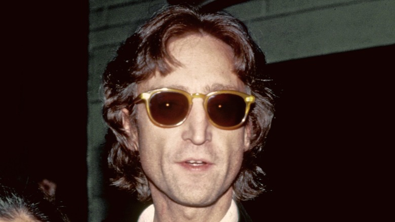 John Lennon wearing sunglasses