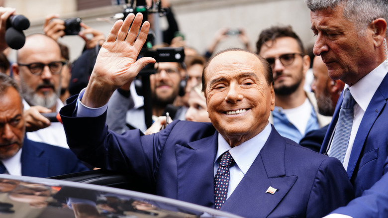 Silvio Berlusconi waving to a crowd
