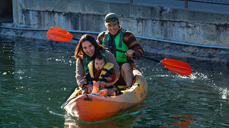 Family rowing a boat