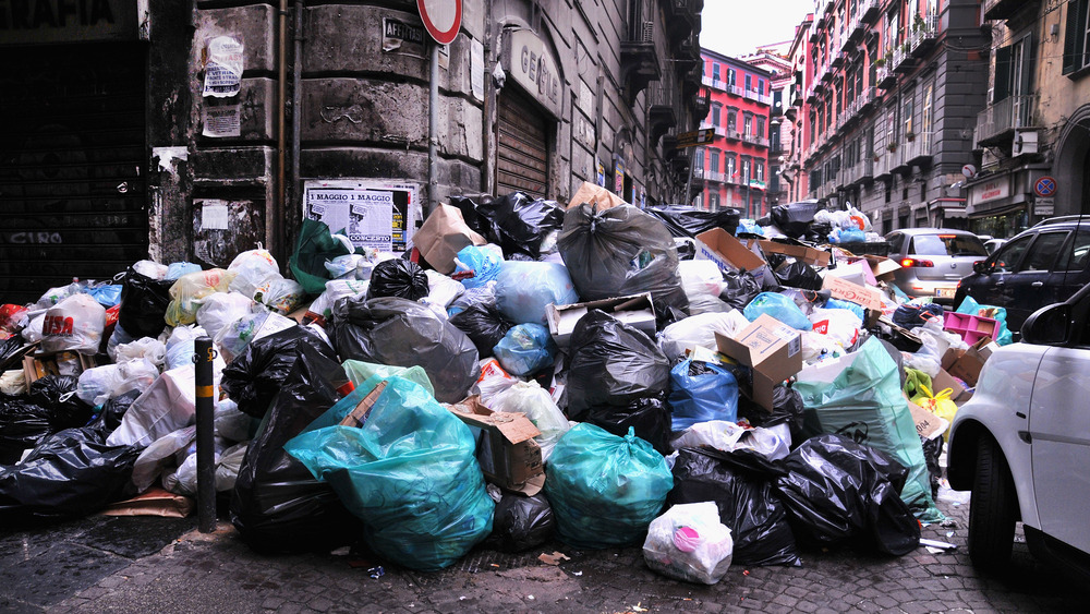 trash piled in the streets of Naples