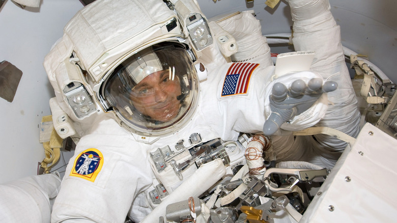 astronaut David Wolf preparing to spacewalk