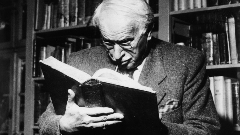 Carl Jung reading a large book