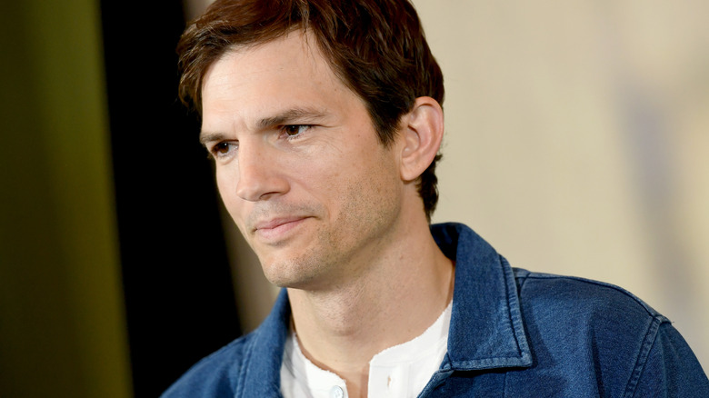 Ashton Kutcher blue denim jacket neutral at event