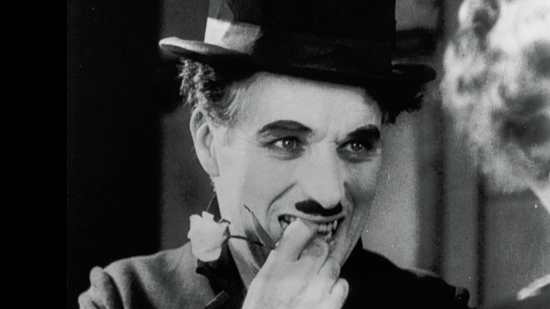 charlie chaplin with hand in mouth