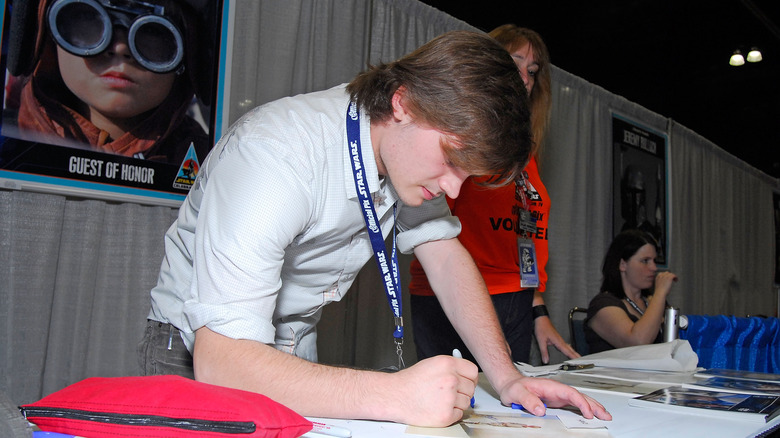Jake Lloyd autographing photo