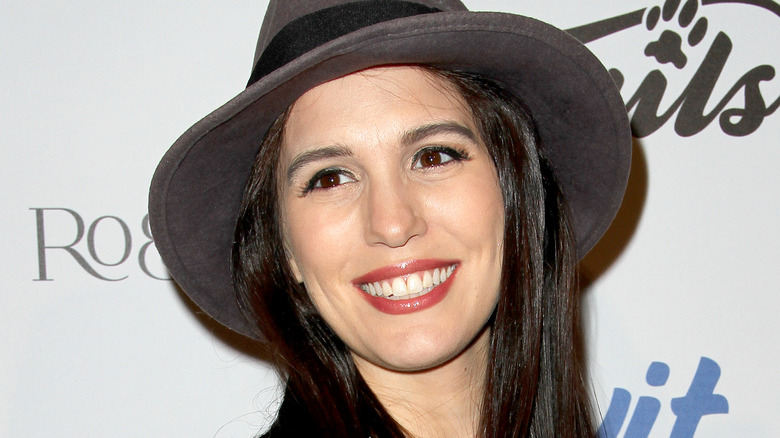 Christy Carlson Romano at event wide hat smiling
