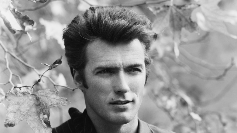 Young Clint Eastwood in front of tree 1960
