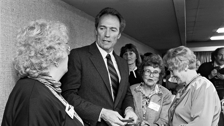 black and white photo Clint Eastwood campaigning for mayor meeting the public