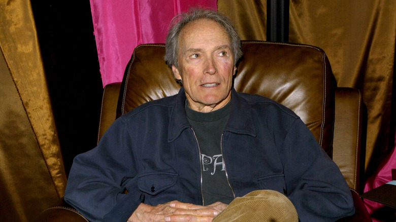 Clint Eastwood sitting back in leather armchair