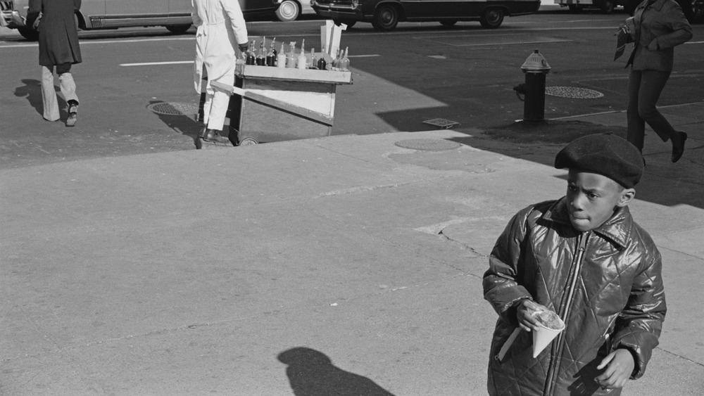 A little boy wearing a beret popularised by the Black Panther Party on a street in Harlem, New York City, circa 1968. 