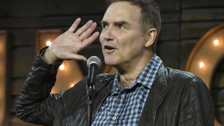 Norm Macdonald on stage performing
