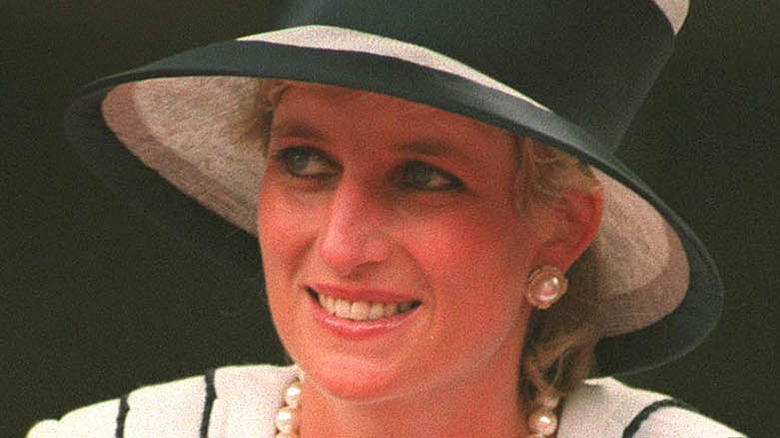 Princess Diana in fancy hat smiling