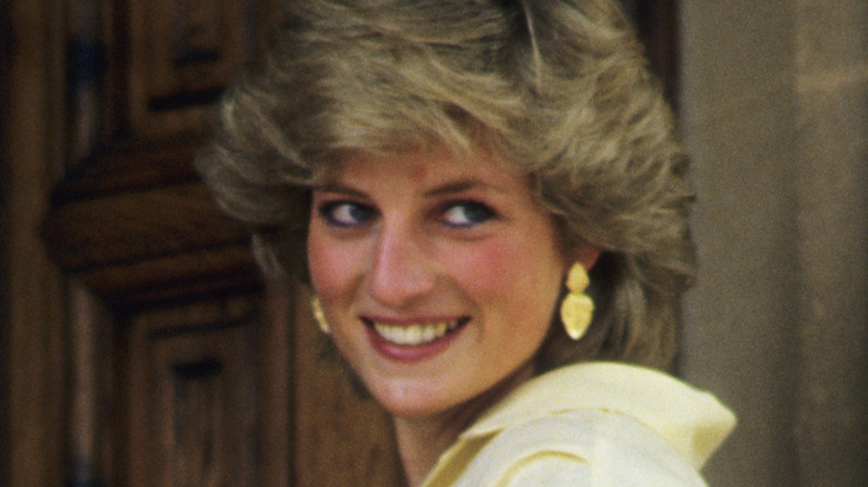 Princess Diana smiling in jumpsuit