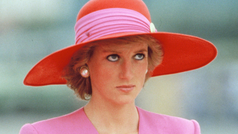 Princess Diana looking unhappy in large hat