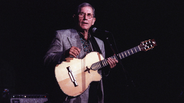 Chet Atkins playing the guitar